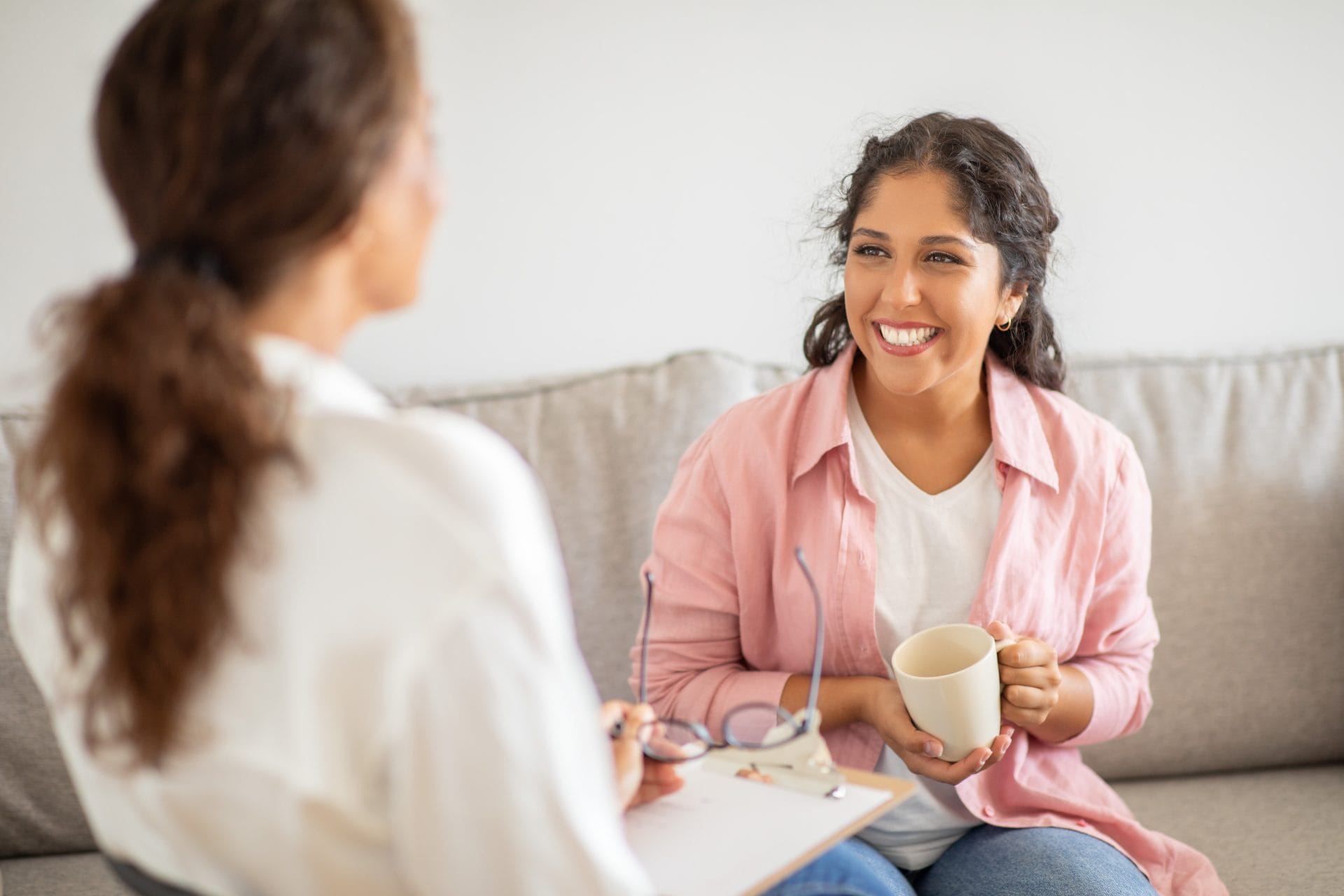 Client speaking with a therapist during a session.