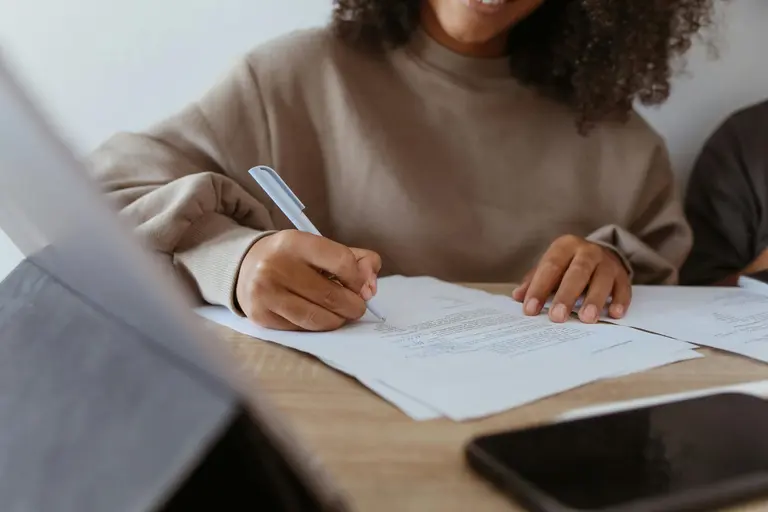 Therapist completing assessment paperwork