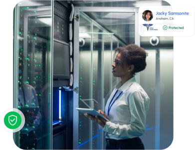 IT professional inspecting secure servers with an overlay showing HIPAA compliance and protected status, highlighting robust data security and privacy safeguards.